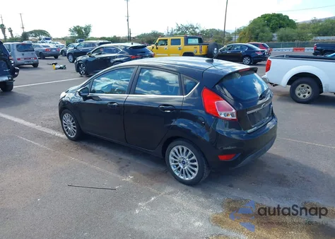 2014 Ford Fiesta Titanium z USA, uszkodzony, nr VIN 3FADP4FJ2EM133695